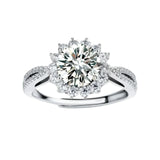 Close-up of sterling silver halo ring with brilliant round moissanite center stone surrounded by smaller accent stones