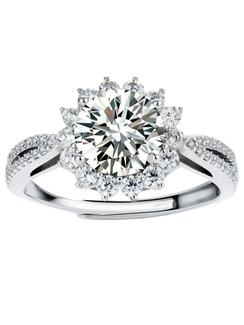 Close-up of sterling silver halo ring with brilliant round moissanite center stone surrounded by smaller accent stones