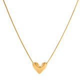 Dainty 18K gold-plated sterling silver necklace with small heart pendant on delicate chain against cream background.