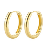 Polished gold-plated sterling silver hoop earrings with hinged closure mechanism on white background.
