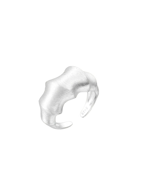 Brushed sterling silver ring with organic wave-like edges and adjustable cuff design on white background